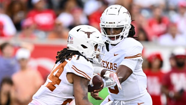 Texas Longhorns quarterback Maalik Murphy (6) hands off the ball to running back Jonathon Brooks (24) during the third quarter against the Houston Cougars at TDECU Stadium.